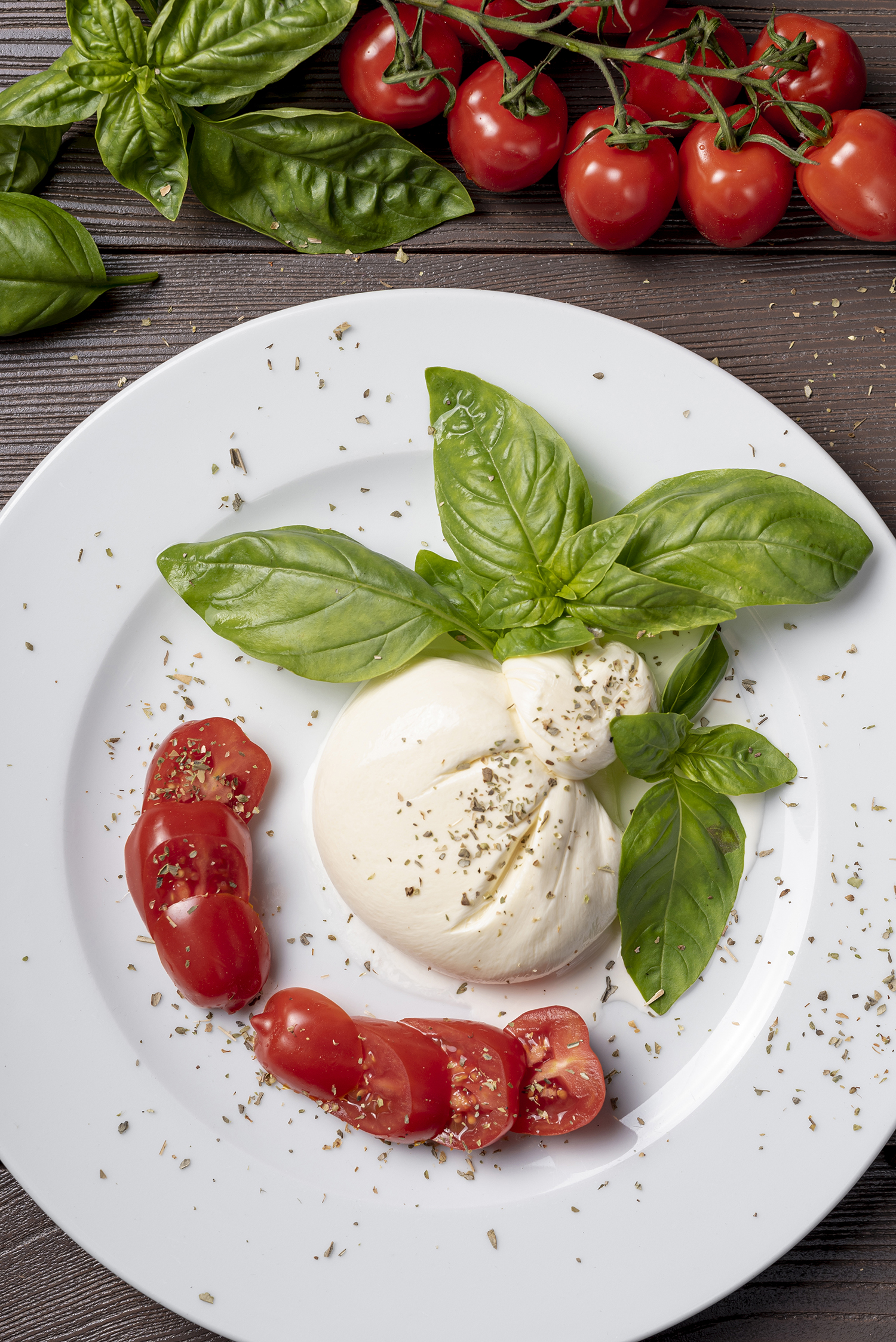 top-view-mozzarella-cherry-tomatoes-wooden-table